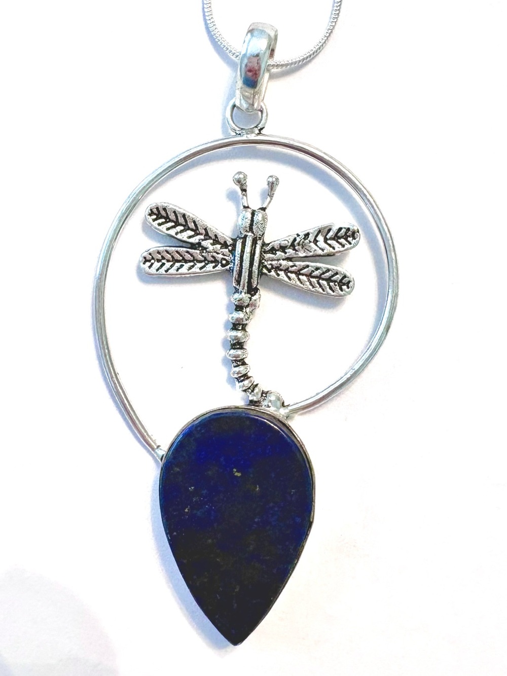 3 inch, 925 marked, Lapis Lazuli gemstone with a silver Dragon Fly on the top .